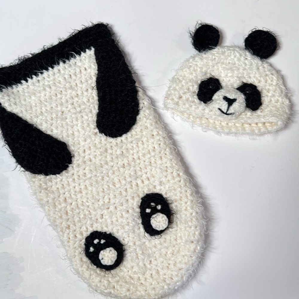 Crocheted panda-themed baby cocoon or sleeping bag